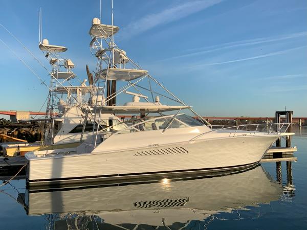 Slide: The Image of 2005 Viking 45 Open Express yacht docked at marina. - 0