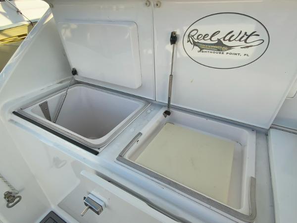 Slide: The Image of 2005 Viking 45 Open Express boat with open storage compartments and Reel Wit logo. - 14