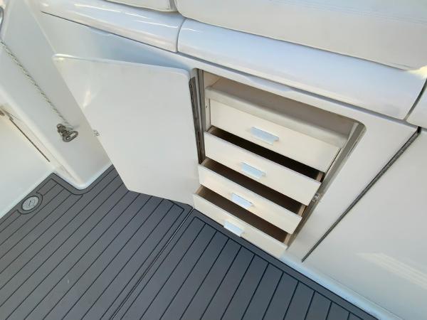 Slide: The Image of Open storage drawers on a 2005 Viking 45 Open Express boat. - 16