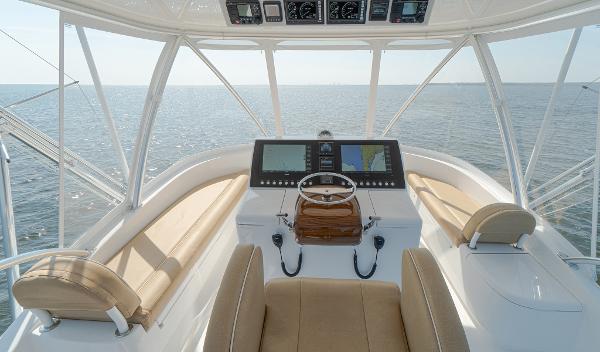 Slide: The Image of 2025 Viking 46 Billfish helm station with modern navigation equipment and panoramic ocean view. - 1