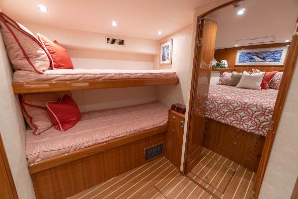 Slide: The Image of Interior cabin of 2025 Viking 46 Billfish with bunk beds and master bedroom. - 4