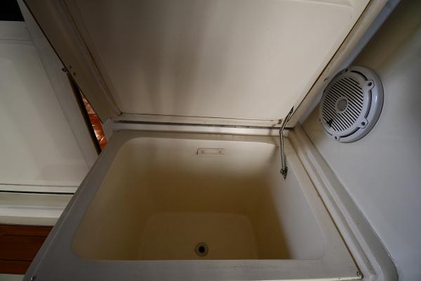 Slide: The Image of Open storage compartment in 1988 Viking 48 Convertible boat interior. - 14