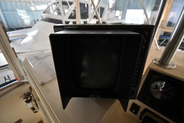 Slide: The Image of 1988 Viking 48 Convertible boat cockpit with navigation equipment. - 26