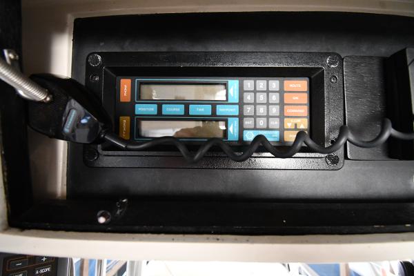 Slide: The Image of Control panel of a 1988 Viking 48 Convertible boat with microphone and keypad. - 29