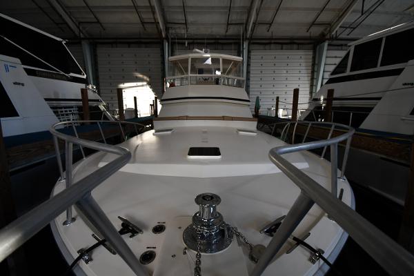 Slide: The Image of 1988 Viking 48 Convertible yacht in storage, showcasing bow and deck details. - 3