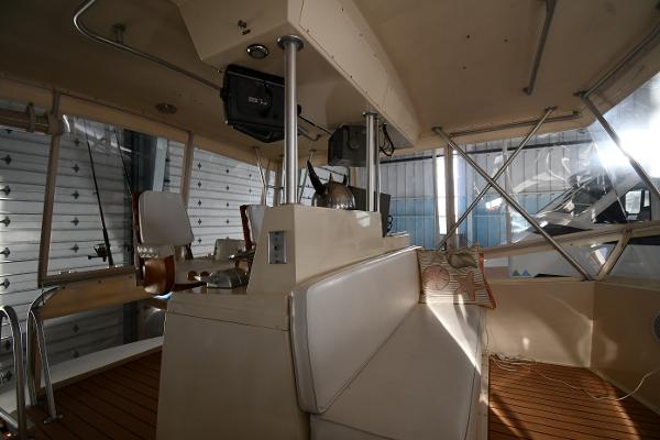 Slide: The Image of Interior of 1988 Viking 48 Convertible yacht with helm and seating area. - 37