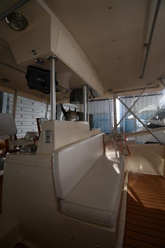 Slide: The Image of 1988 Viking 48 Convertible interior with seating and helm, showcasing classic design and functionality. - 38