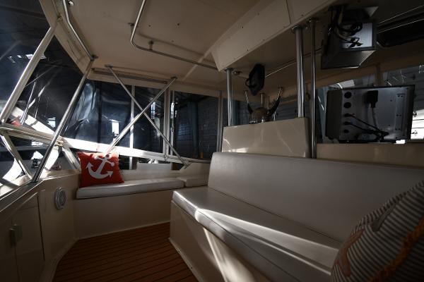 Slide: The Image of Interior of 1988 Viking 48 Convertible yacht with seating and nautical decor. - 39