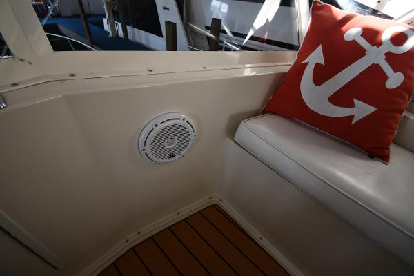 Slide: The Image of Interior of 1988 Viking 48 Convertible with anchor-themed pillow and speaker. - 41