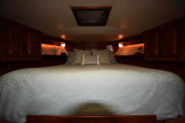 Slide: The Image of Luxurious bedroom interior of 1988 Viking 48 Convertible yacht with elegant bedding. - 46