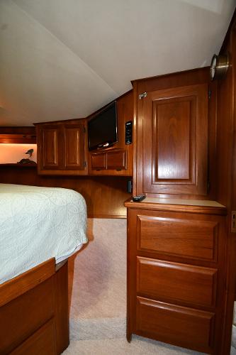 Slide: The Image of Interior of 1988 Viking 48 Convertible yacht with wooden cabinetry and bed. - 47