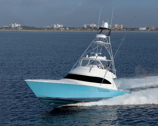 Slide: The Image of 2025 Viking 58 Convertible yacht cruising on open water. - 1