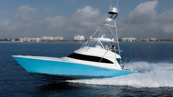 Slide: The Image of 2025 Viking 58 Convertible yacht cruising on open water. - 2