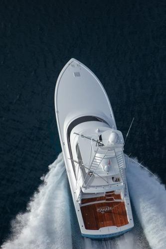 Slide: The Image of Aerial view of 2025 Viking 58 Convertible yacht cruising on water. - 3