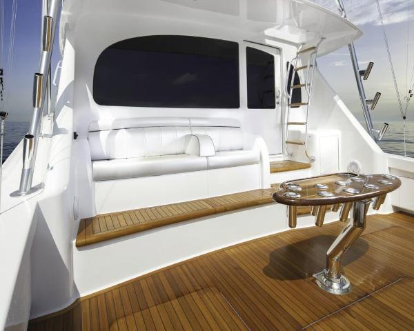 Slide: The Image of 2025 Viking 58 Convertible yacht with teak deck and white seating. - 6