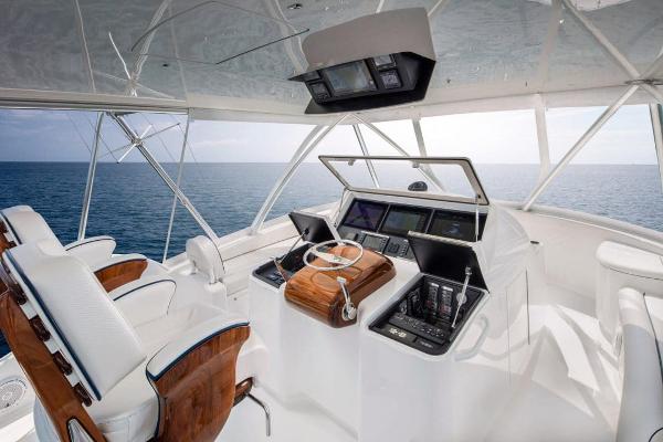 Slide: The Image of 2025 Viking 58 Convertible yacht helm with ocean view. - 9