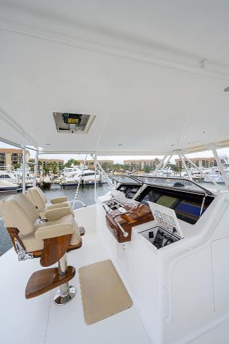 Slide: The Image of 2005 Viking 61 yacht helm with dual seats and advanced navigation controls. - 11
