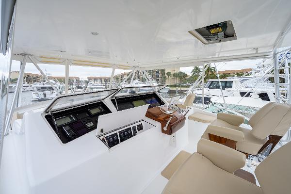 Slide: The Image of Interior view of 2005 Viking 61 yacht cockpit with navigation controls and seating. - 14