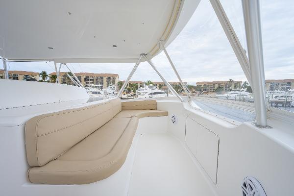 Slide: The Image of 2005 Viking 61 yacht interior with beige seating and marina view. - 18