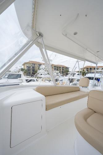 Slide: The Image of 2005 Viking 61 yacht interior with beige seating and marina view. - 19