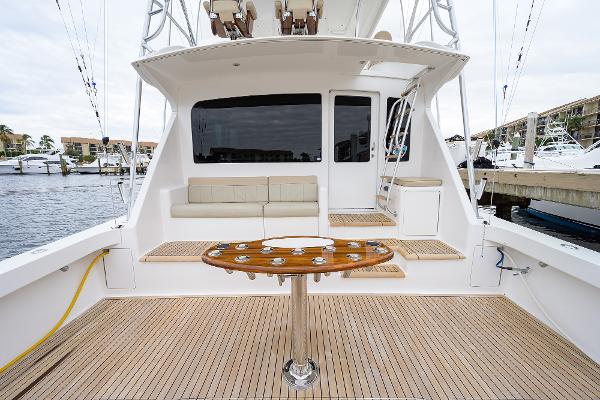 Slide: The Image of 2005 Viking 61 yacht deck with seating and fishing table, docked at marina. - 24
