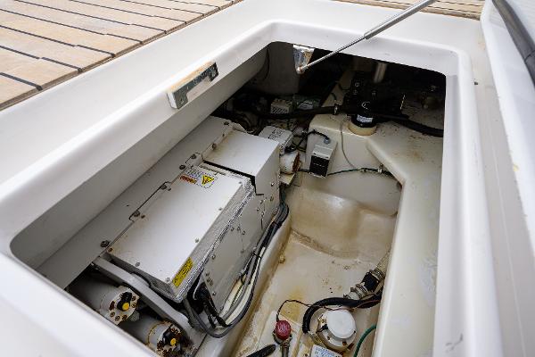Slide: The Image of Engine compartment of a 2005 Viking 61 yacht, showcasing mechanical components and wiring. - 30