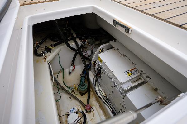 Slide: The Image of Engine compartment of a 2005 Viking 61 yacht, showcasing mechanical components and wiring. - 31