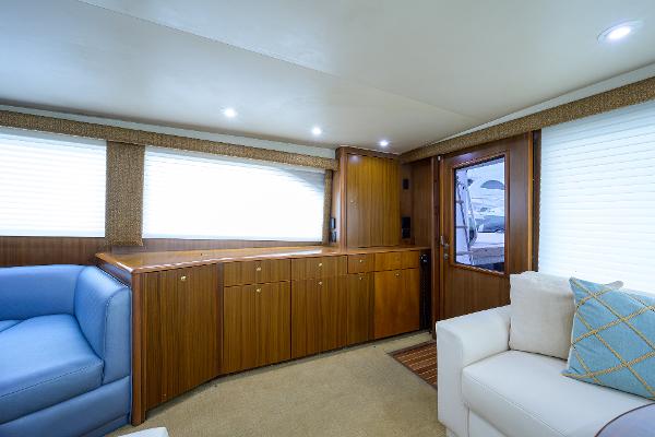 Slide: The Image of Luxurious interior of 2005 Viking 61 yacht with wood cabinetry and plush seating. - 35