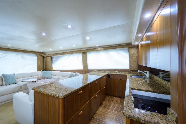 Slide: The Image of Luxurious interior of 2005 Viking 61 yacht with modern kitchen and seating area. - 40