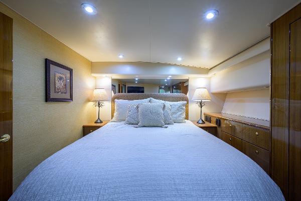 Slide: The Image of Luxurious bedroom interior of 2005 Viking 61 yacht with cozy lighting and elegant decor. - 43