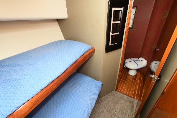 Slide: The Image of Bunk beds and bathroom in 2000 Viking 65 Convertible yacht. - 27