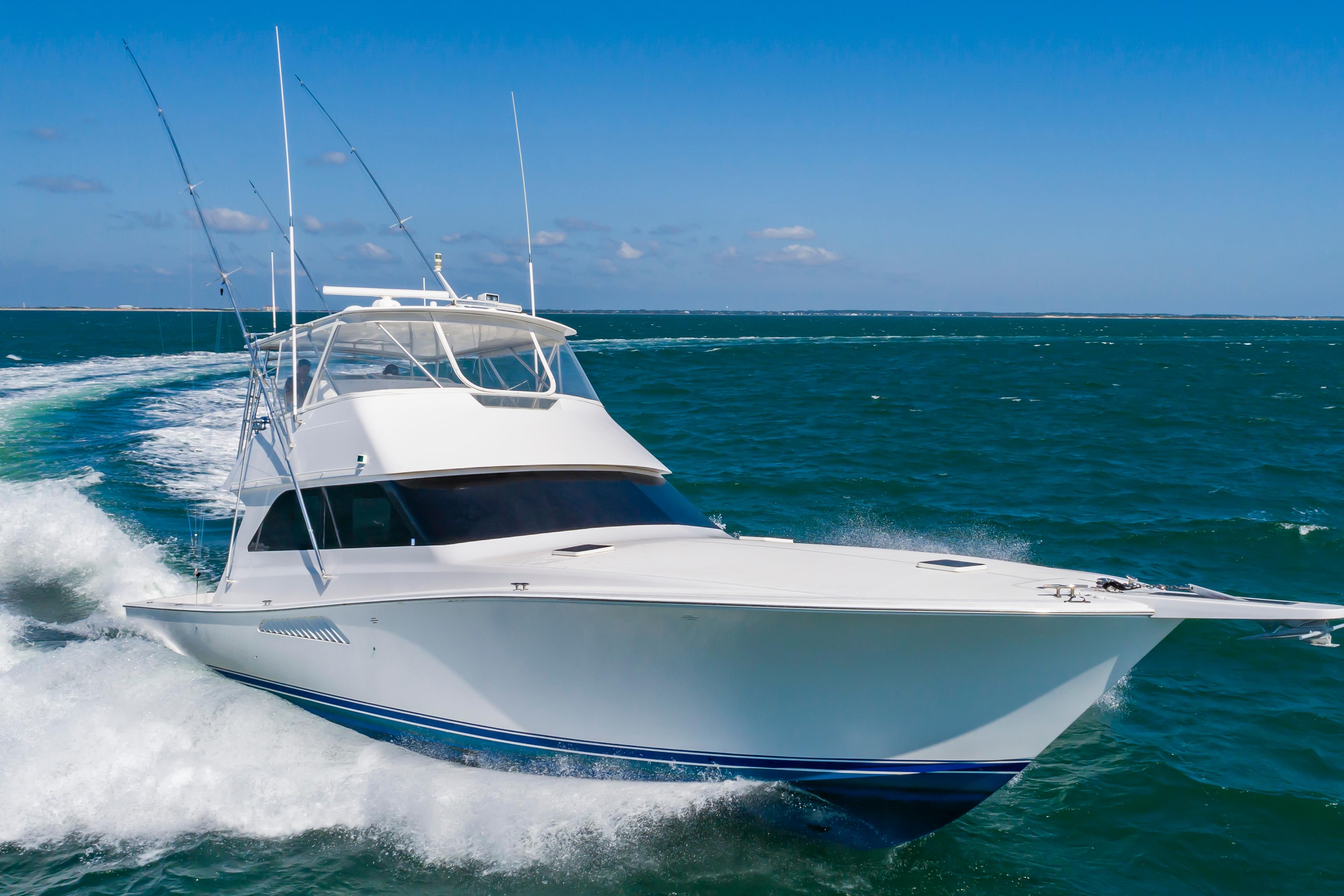 Slide: The Image of 1998 Viking Convertible yacht cruising on open water. - 11