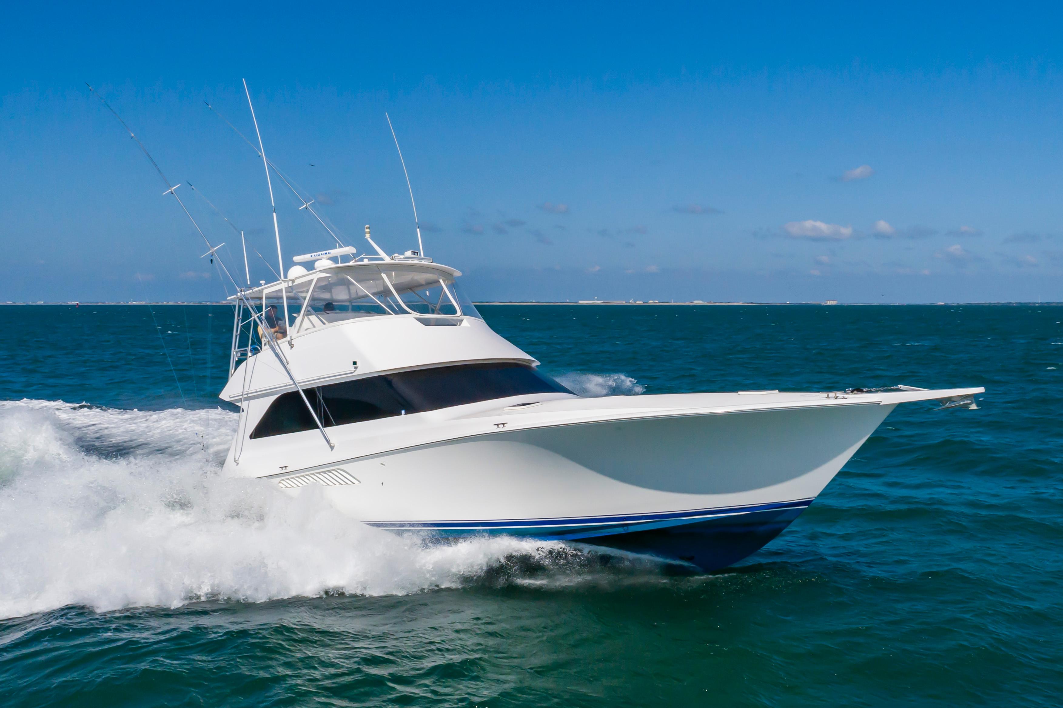 Slide: The Image of 1998 Viking Convertible yacht cruising on open blue ocean. - 12