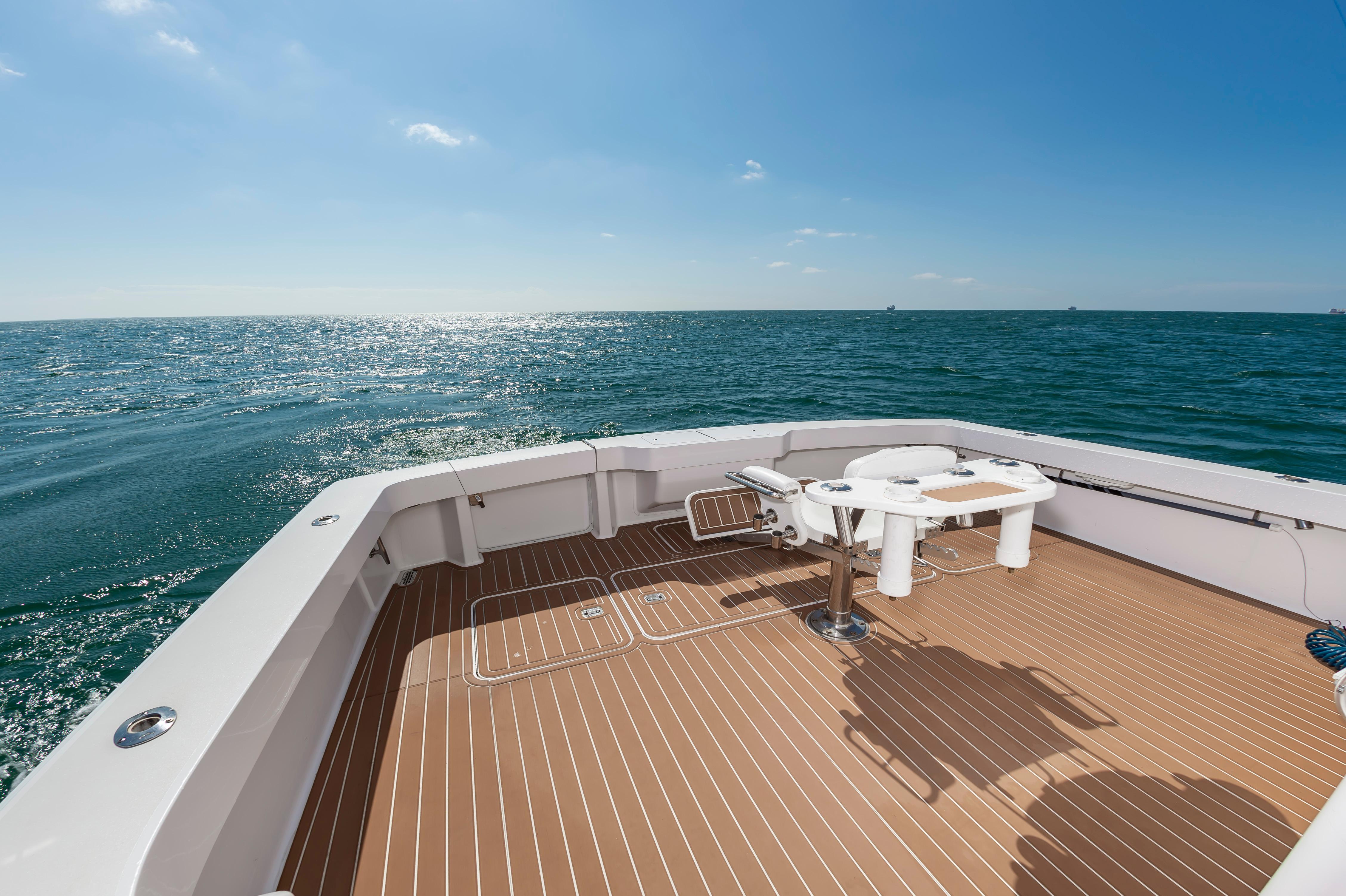 Slide: The Image of 1998 Viking Convertible boat deck with ocean view. - 22