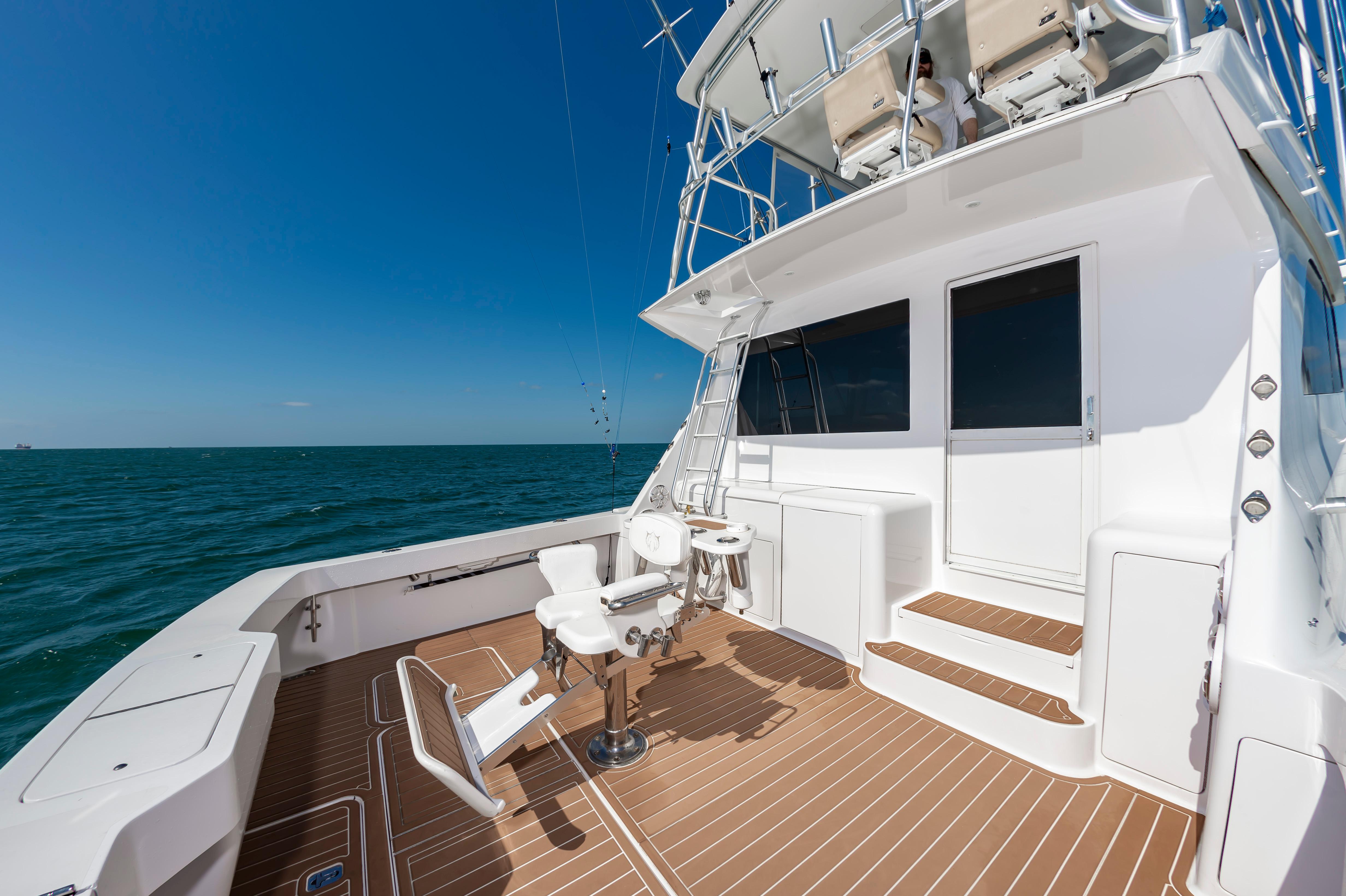 Slide: The Image of 1998 Viking Convertible yacht deck with fishing chair and ocean view. - 24