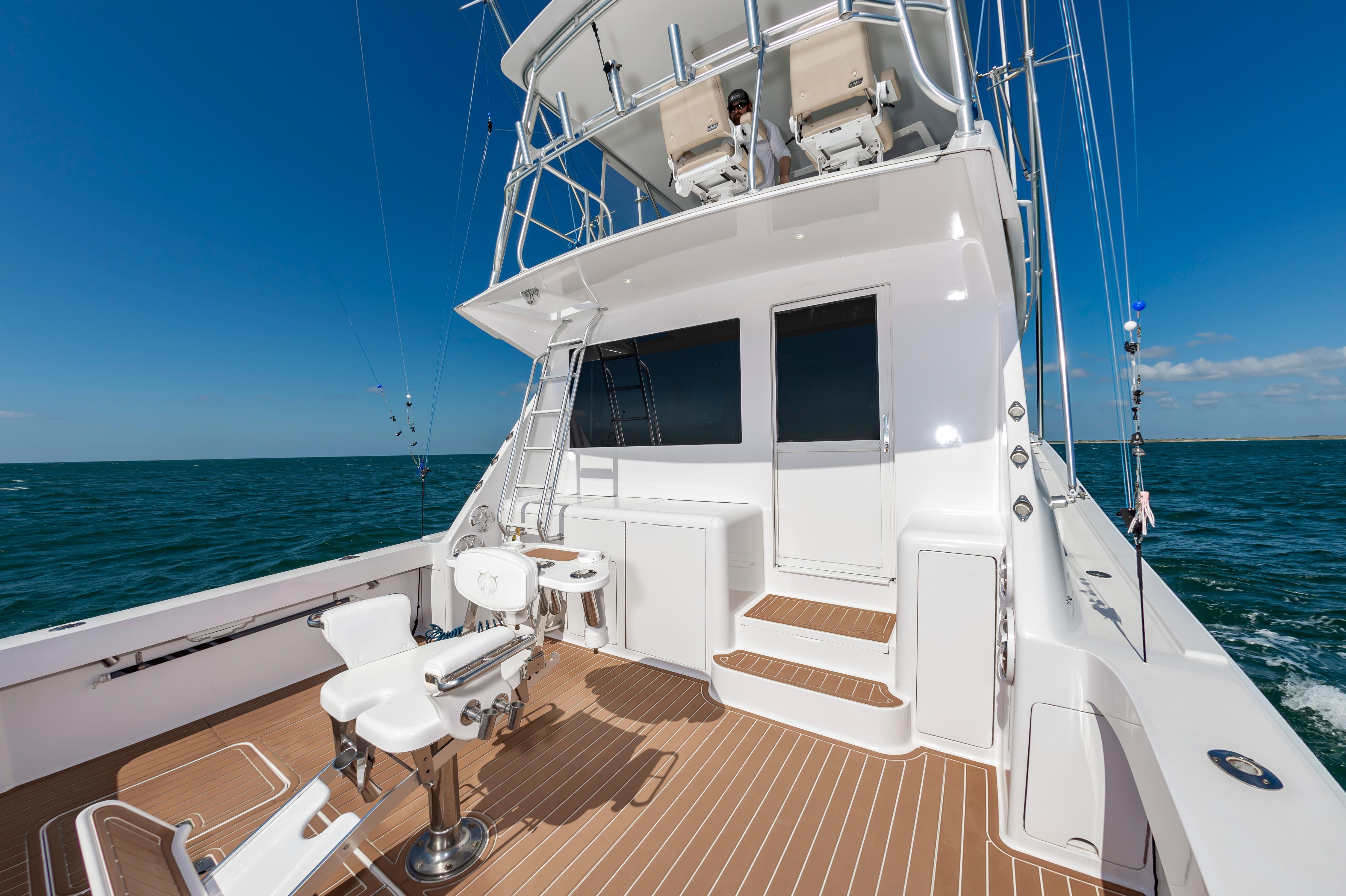 Slide: The Image of 1998 Viking Convertible yacht with fishing chairs and ocean view. - 27