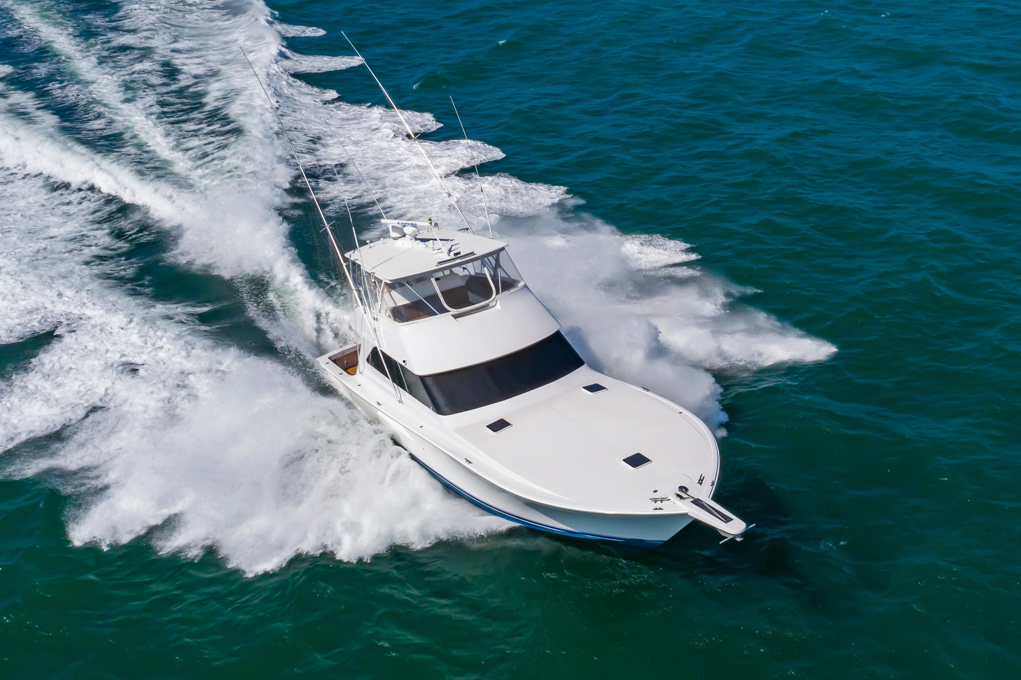 Slide: The Image of 1998 Viking Convertible yacht cruising on open water. - 3