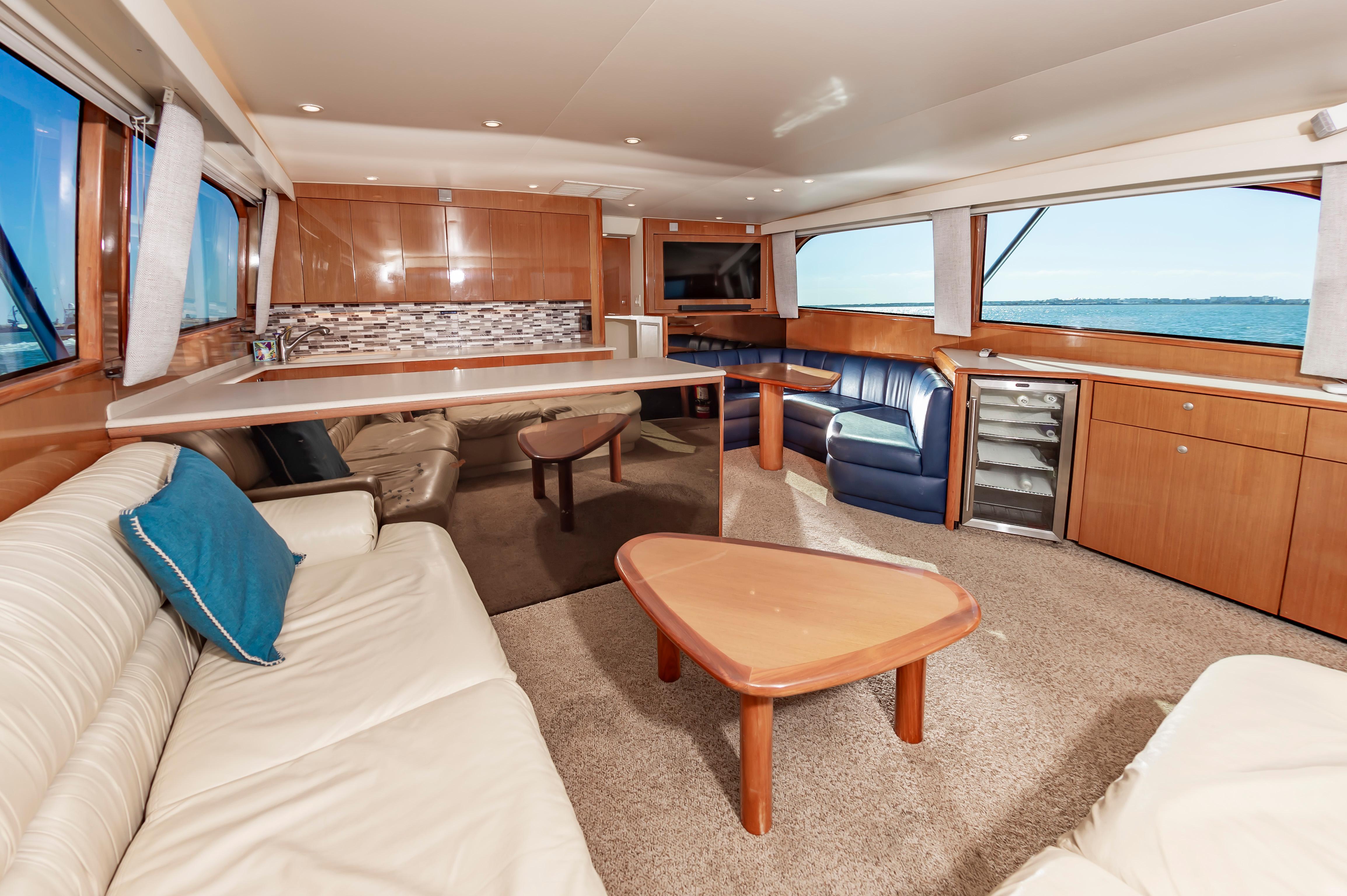 Slide: The Image of Luxurious interior of a 1998 Viking Convertible yacht with modern furnishings. - 31