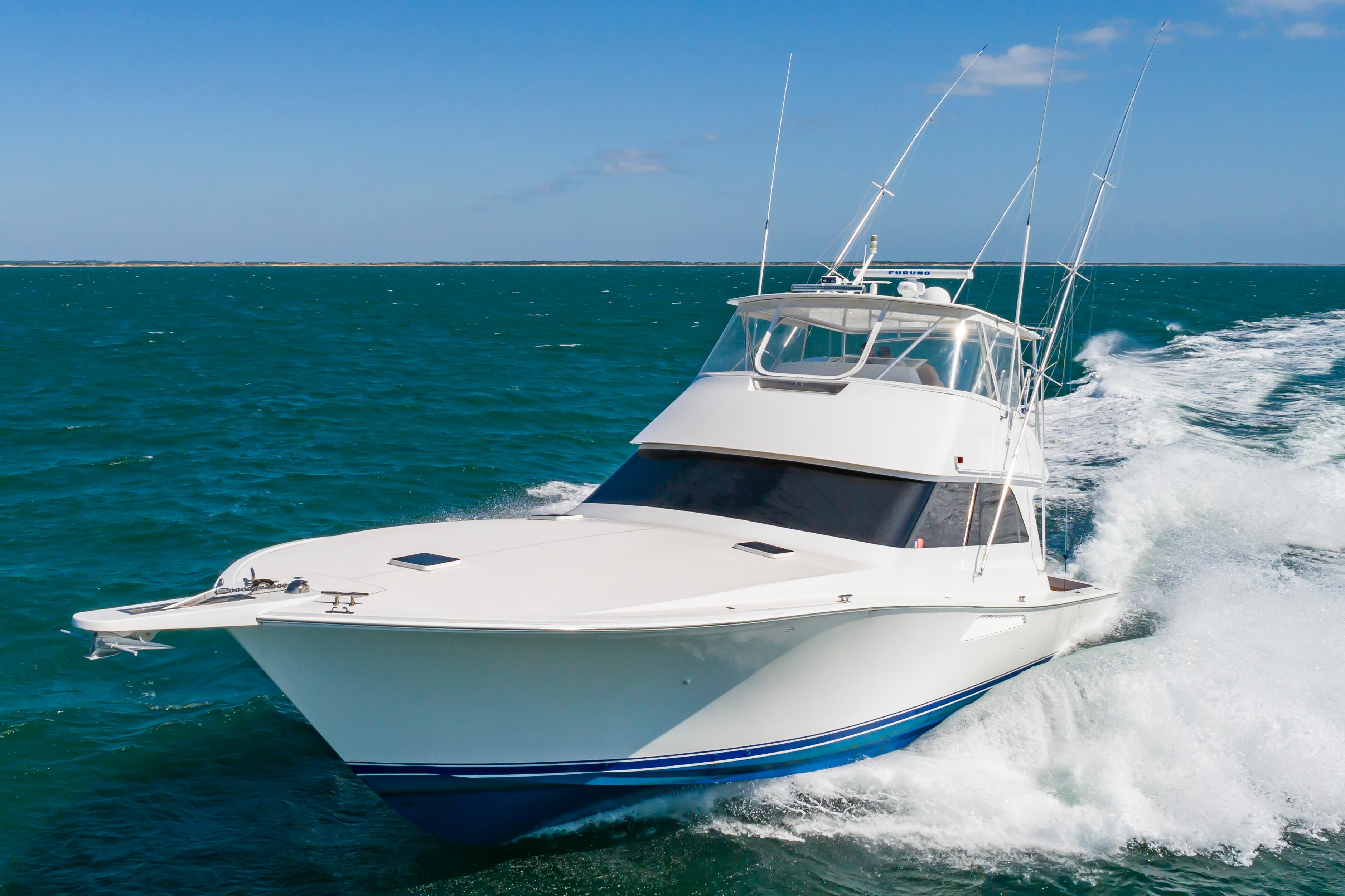 Slide: The Image of 1998 Viking Convertible yacht cruising on open blue ocean. - 4