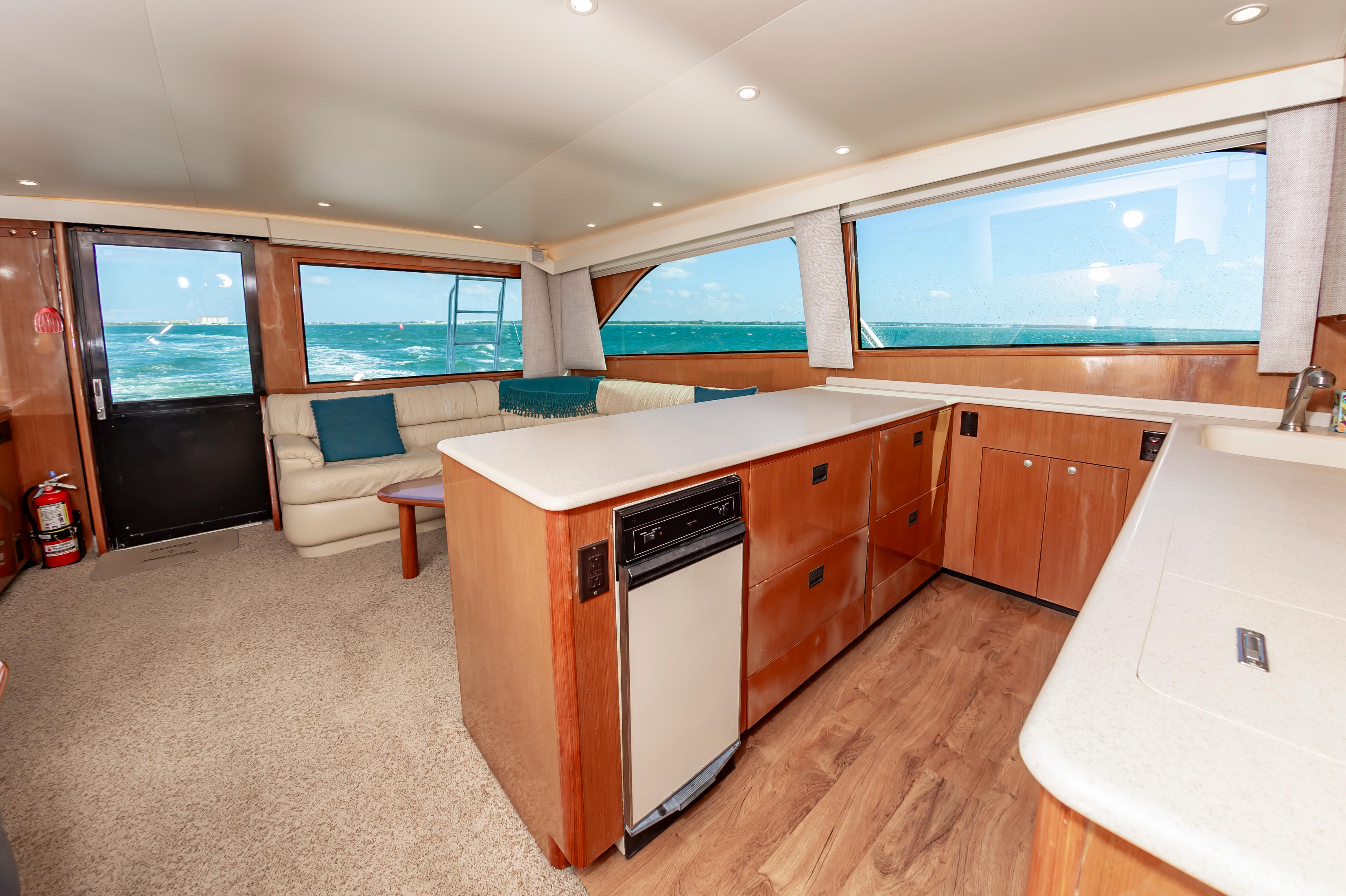 Slide: The Image of Interior of 1998 Viking Convertible yacht with modern kitchen and ocean view. - 41