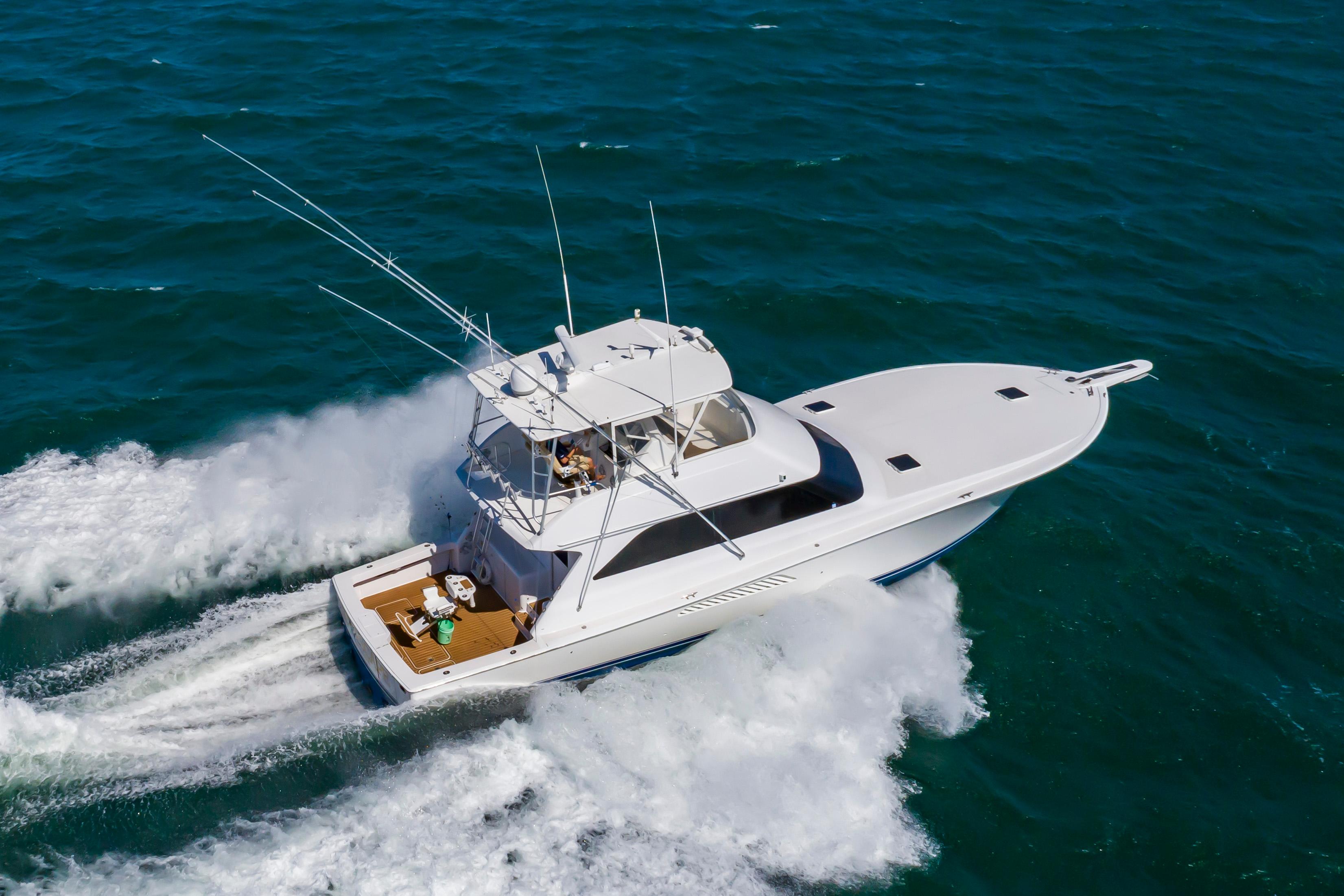 Slide: The Image of 1998 Viking Convertible yacht cruising on open water. - 5