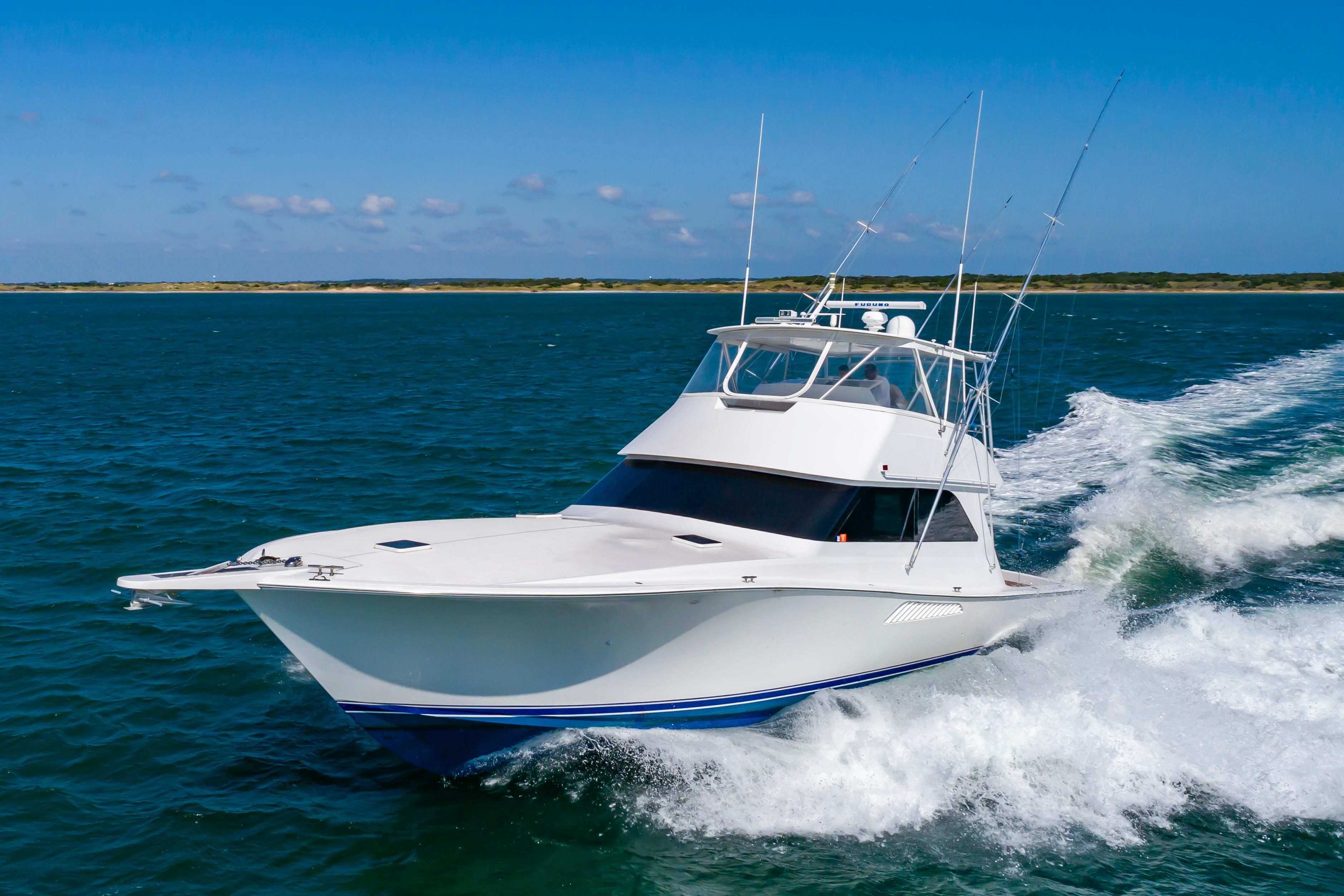 Slide: The Image of 1998 Viking Convertible yacht cruising on open water. - 6