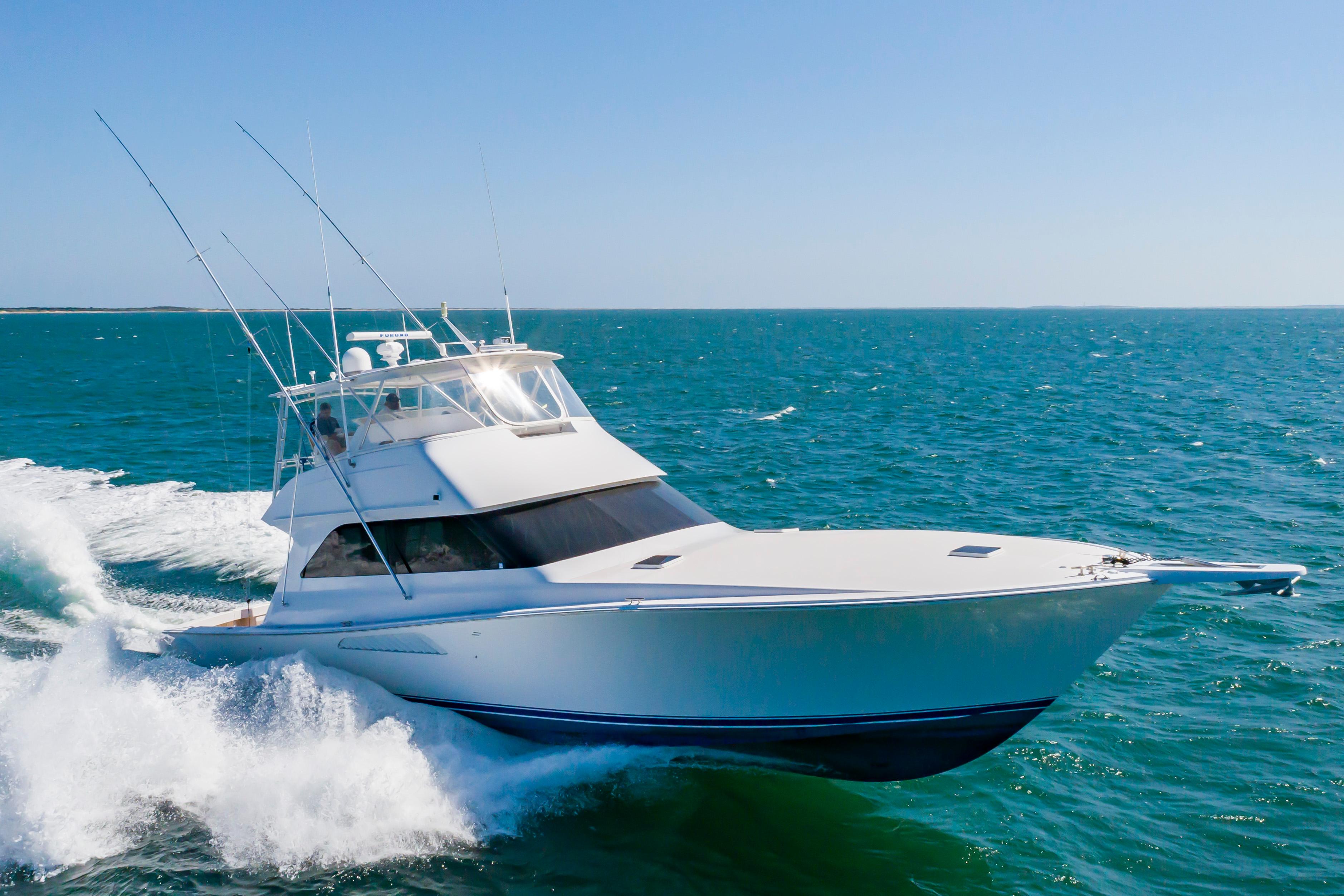 Slide: The Image of 1998 Viking Convertible yacht cruising on open water. - 7