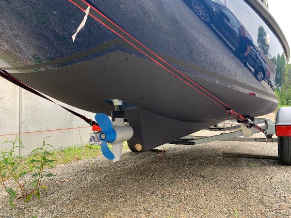 Slide: The Image of 2023 Vision Marine Technologies Fantail 217 boat on trailer, showing propeller and hull. - 11
