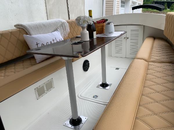 Slide: The Image of Interior of 2023 Vision Marine Technologies Fantail 217 with table and seating. - 5