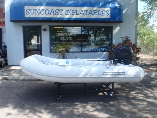 Slide: The Image of 2016 Walker Bay Odyssey 310 SLRX inflatable boat outside Suncoast Inflatables store. - 0