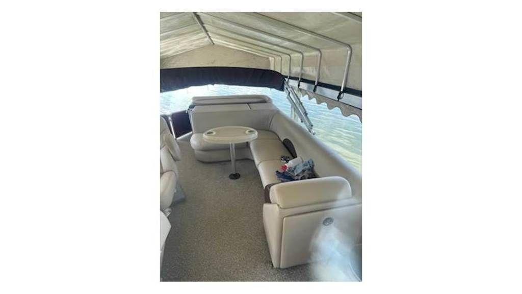 Slide: The Image of 2016 Weeres Pontoons ECLIPSE 240TT #19870 interior with seating and table. - 11