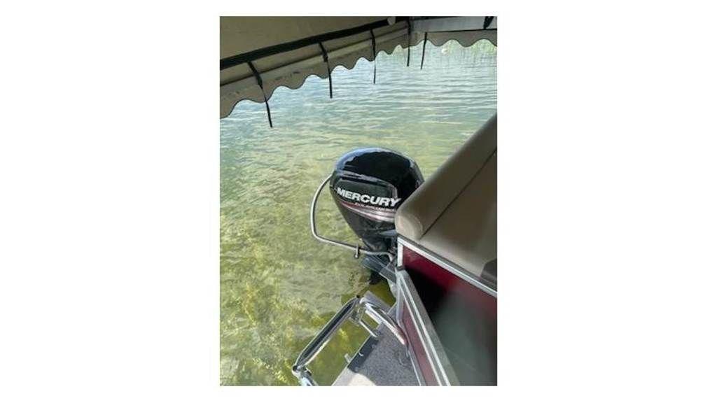 Slide: The Image of 2016 Weeres Pontoons ECLIPSE 240TT with Mercury outboard motor in water. - 13