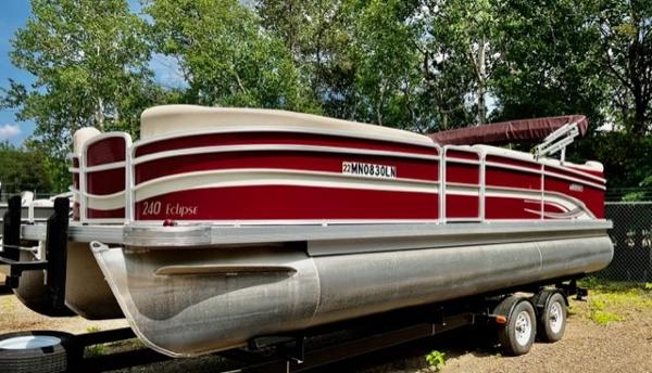 Slide: The Image of 2016 Weeres Pontoons ECLIPSE 240TT on trailer, red and white, parked outdoors. - 2