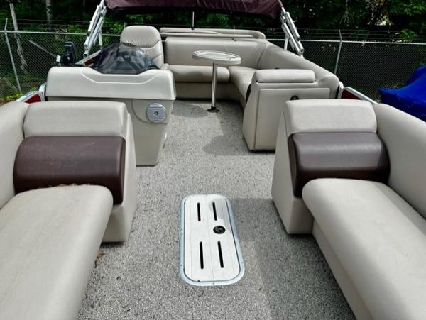 Slide: The Image of 2016 Weeres Pontoons ECLIPSE 240TT interior with beige and brown seating. - 4